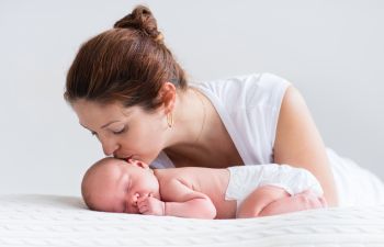 Marietta GA New Mom Kissing Her Baby